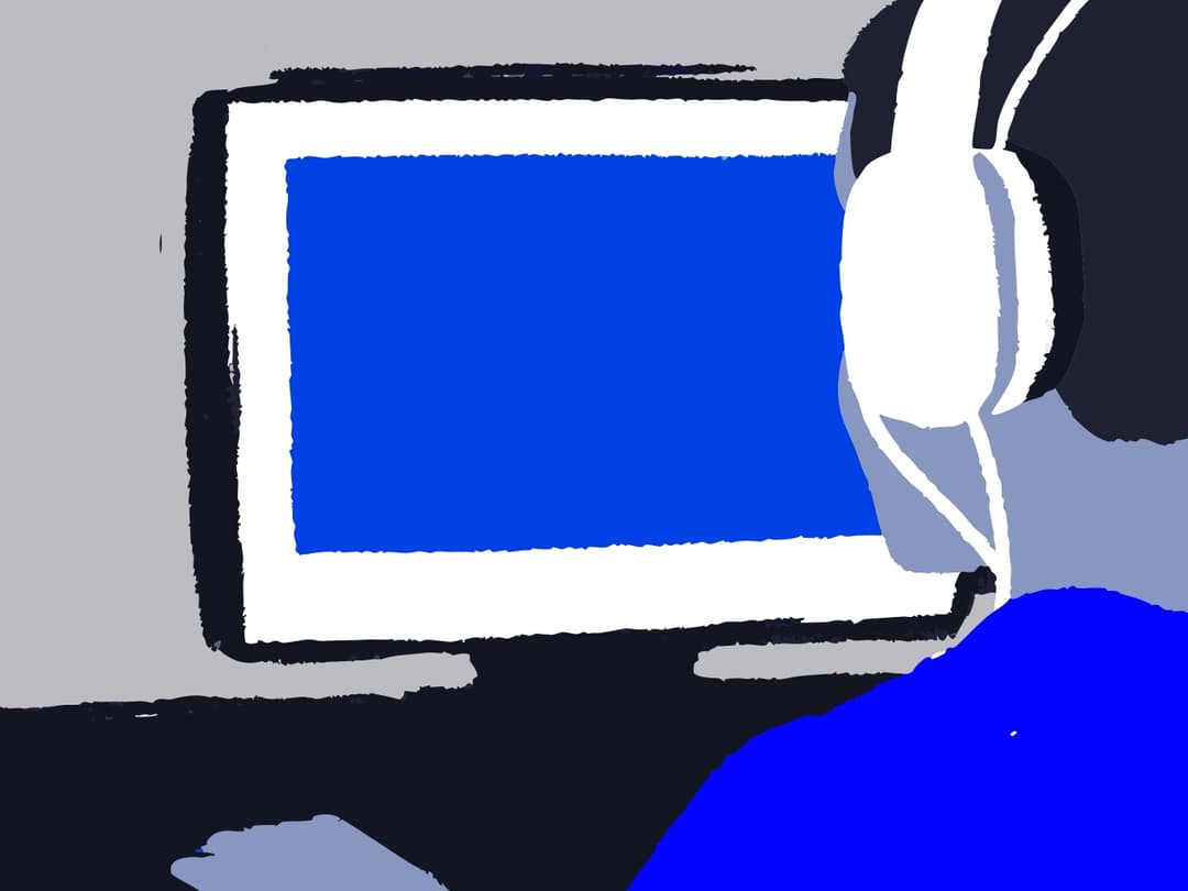 Person using headphones while using a computer